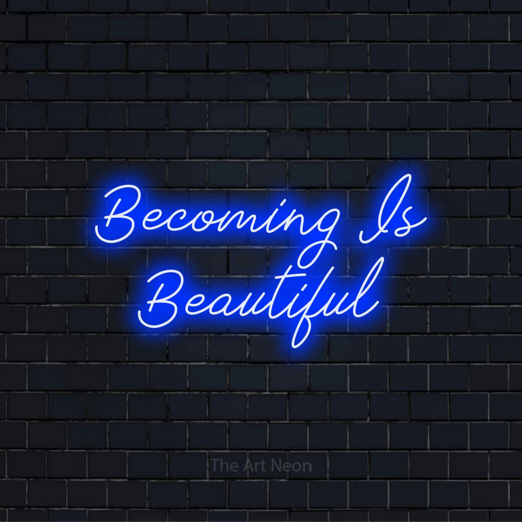"Becoming Is Beautiful" neon text design on a black brick wall