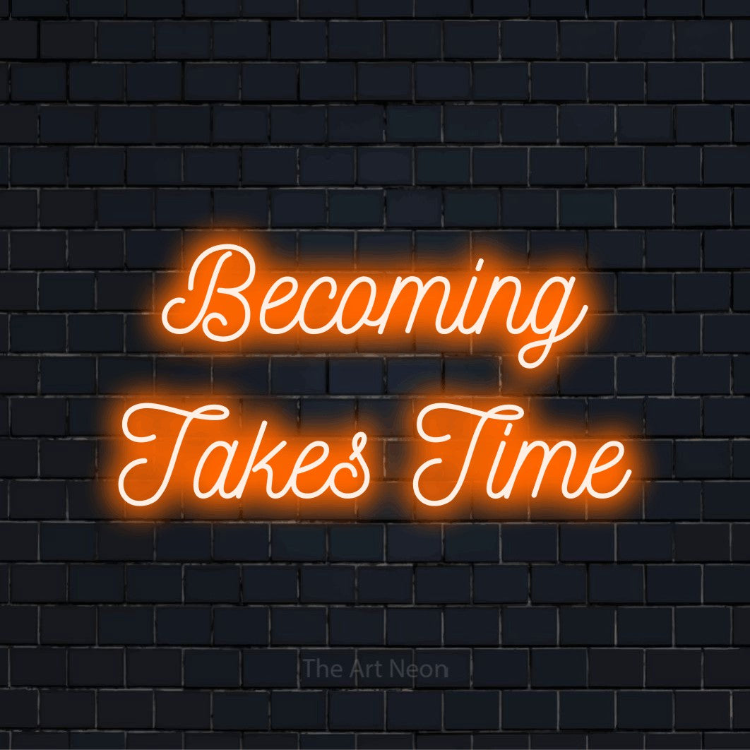 "Becoming Takes Time" neon text design on a black brick wall