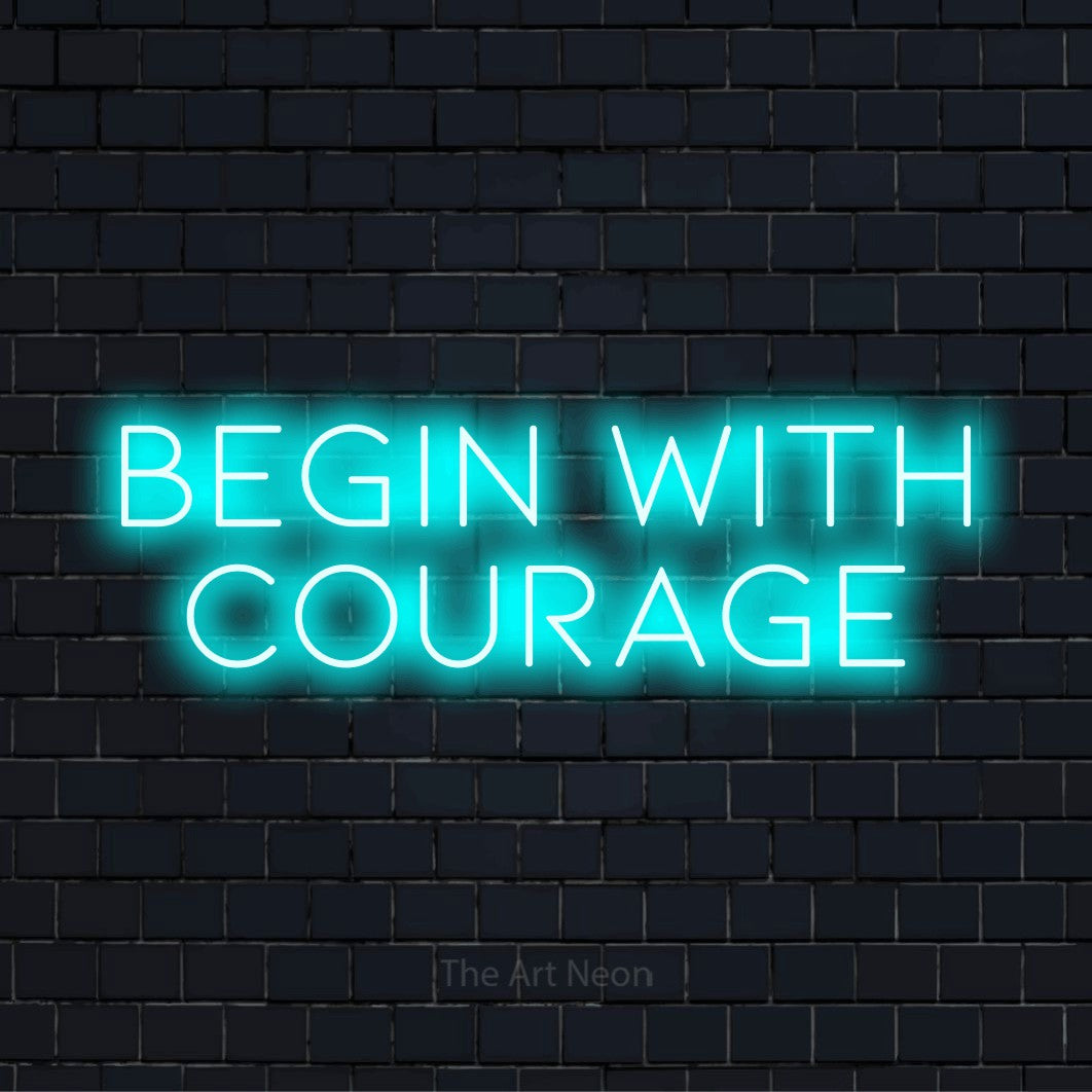 "Begin With Courage" glowing LED neon sign on a black brick wall
