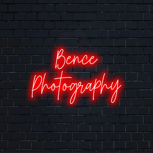 Bence Photography Personalized LED Neon Sign, glowing neon text against black brick wall