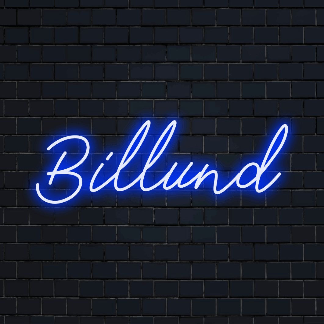 Billund LED Neon Sign, glowing neon text on dark brick wall