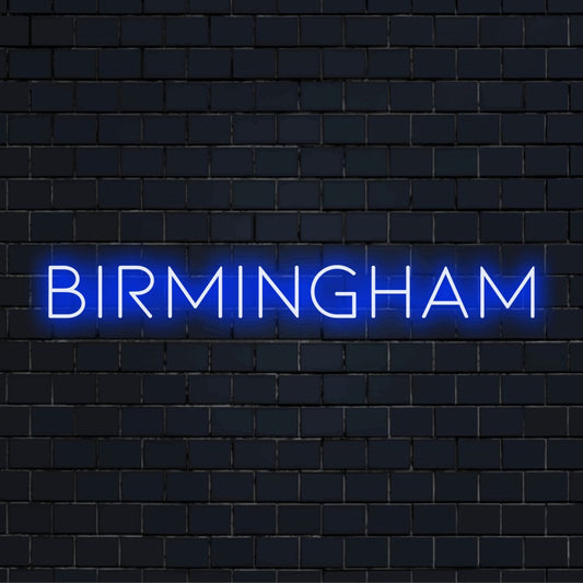 Birmingham LED Neon Sign, soft neon glow against black brick wall