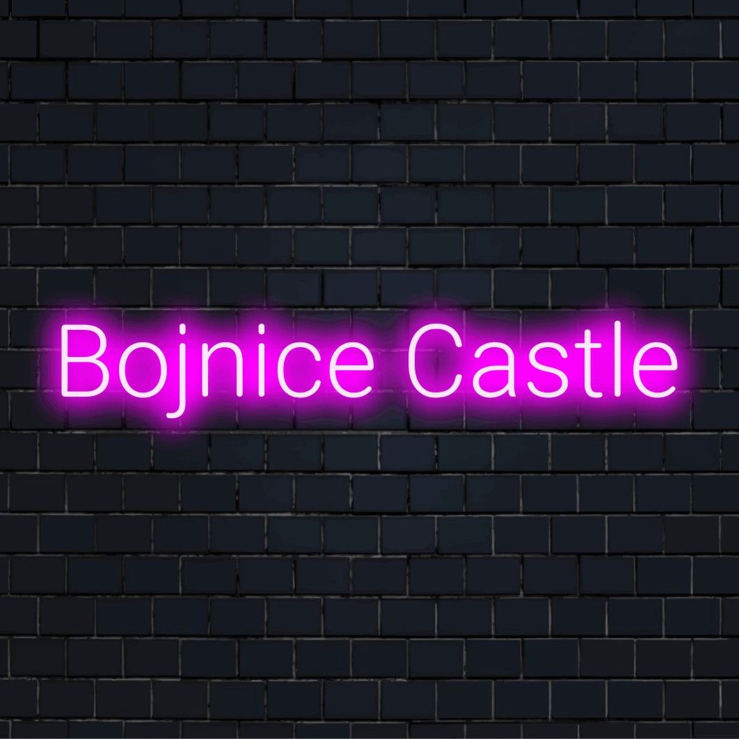 Bojnice Castle LED Neon Sign, bright neon lettering on dark brick wall