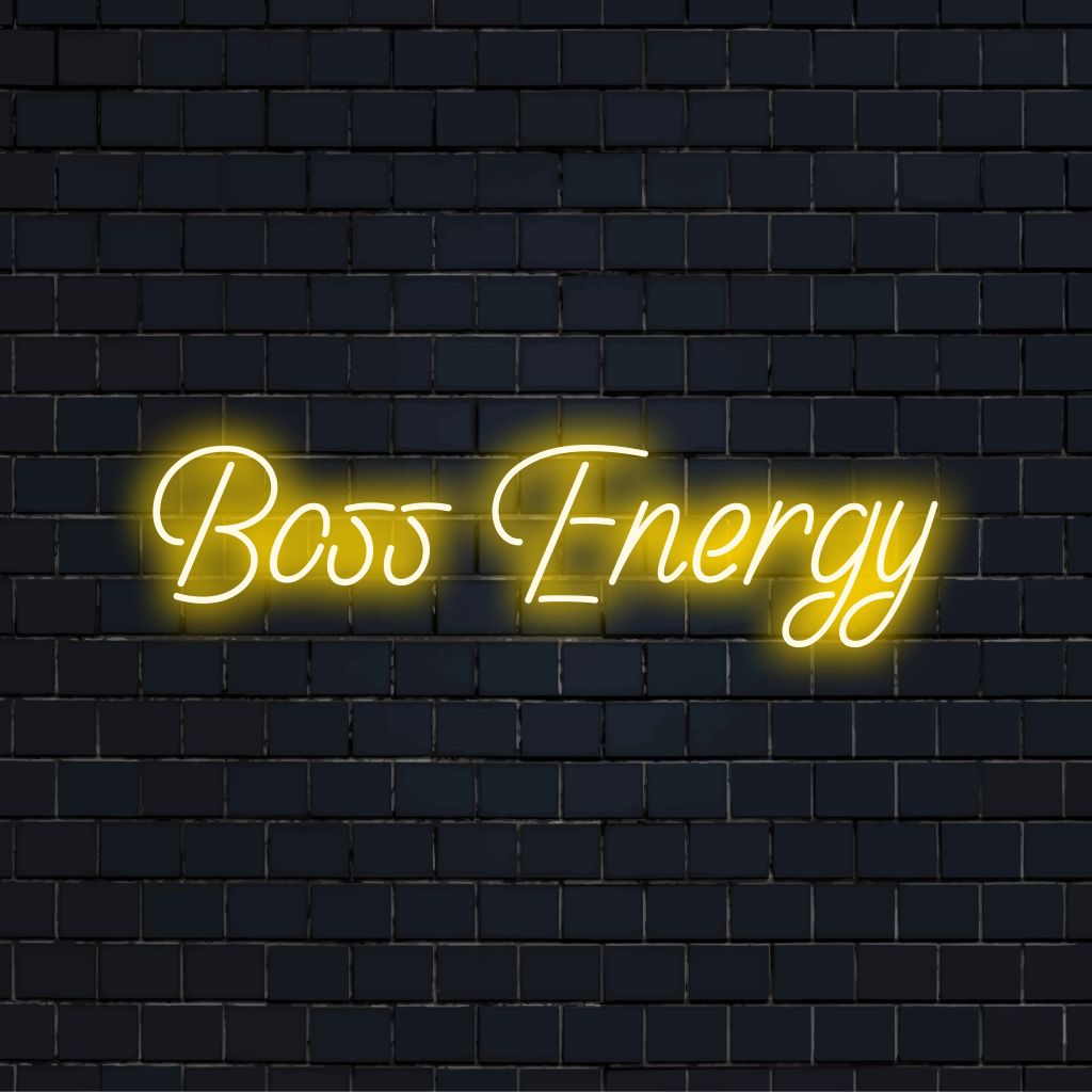 Boss Energy Neon Sign, glowing lettering on dark brick wall