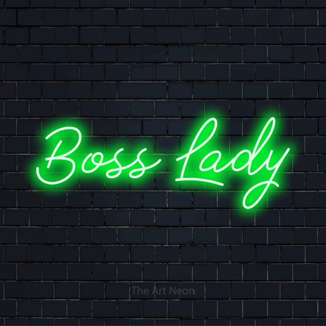"Boss Lady" script-style LED neon sign on a black brick wall