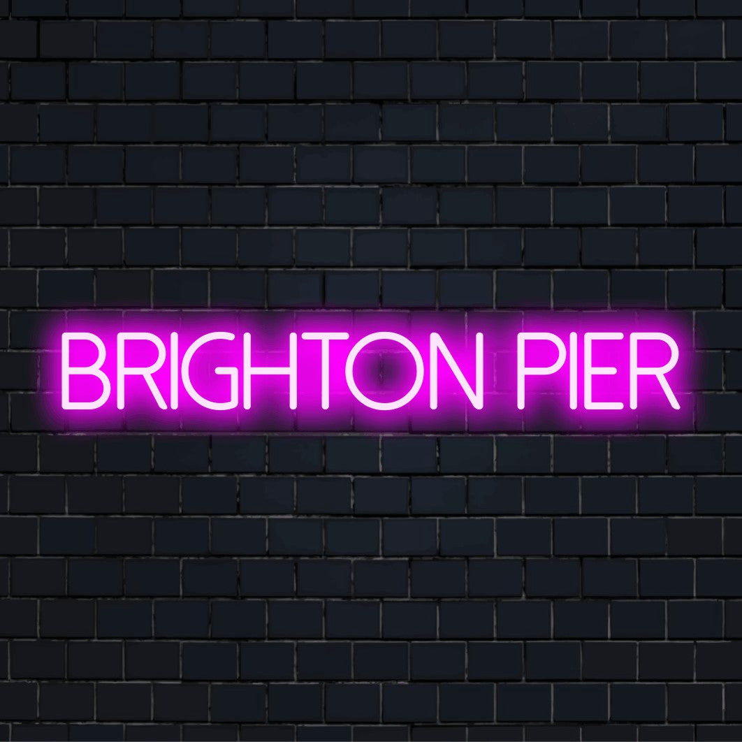 Brighton Pier LED Neon Sign, bright LED glow on dark brick background