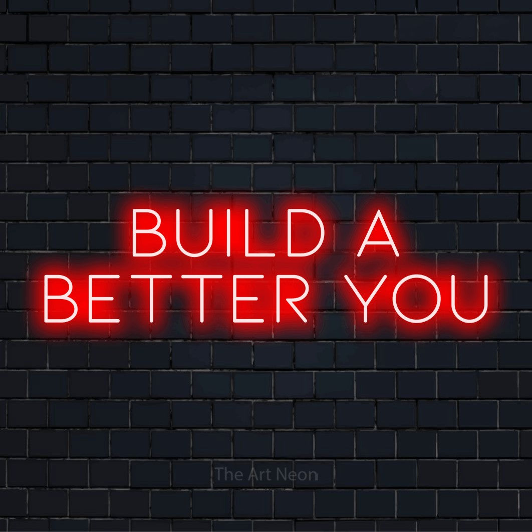 "Build A Better You" text design with neon effect on a black brick wall