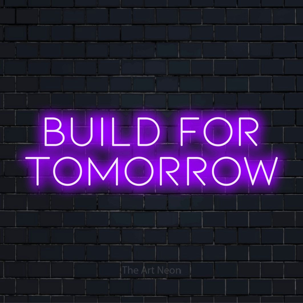 "Build For Tomorrow" neon text design on a black brick wall