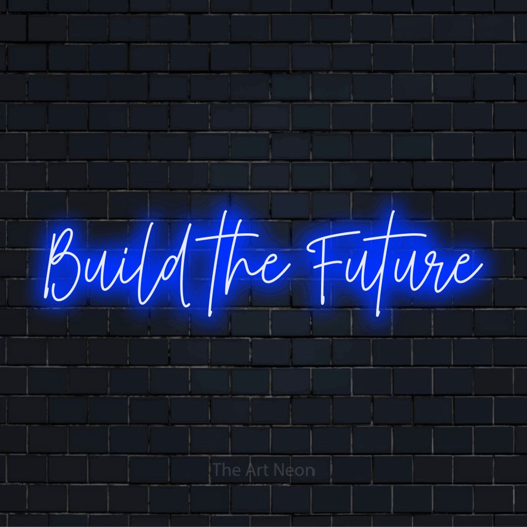 "Build The Future" glowing LED neon sign on a black brick wall