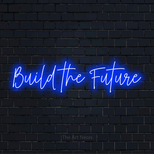 "Build The Future" glowing LED neon sign on a black brick wall
