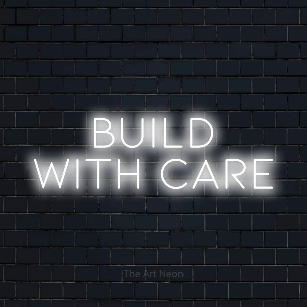 "Build With Care" text design with neon effect on a black brick wall