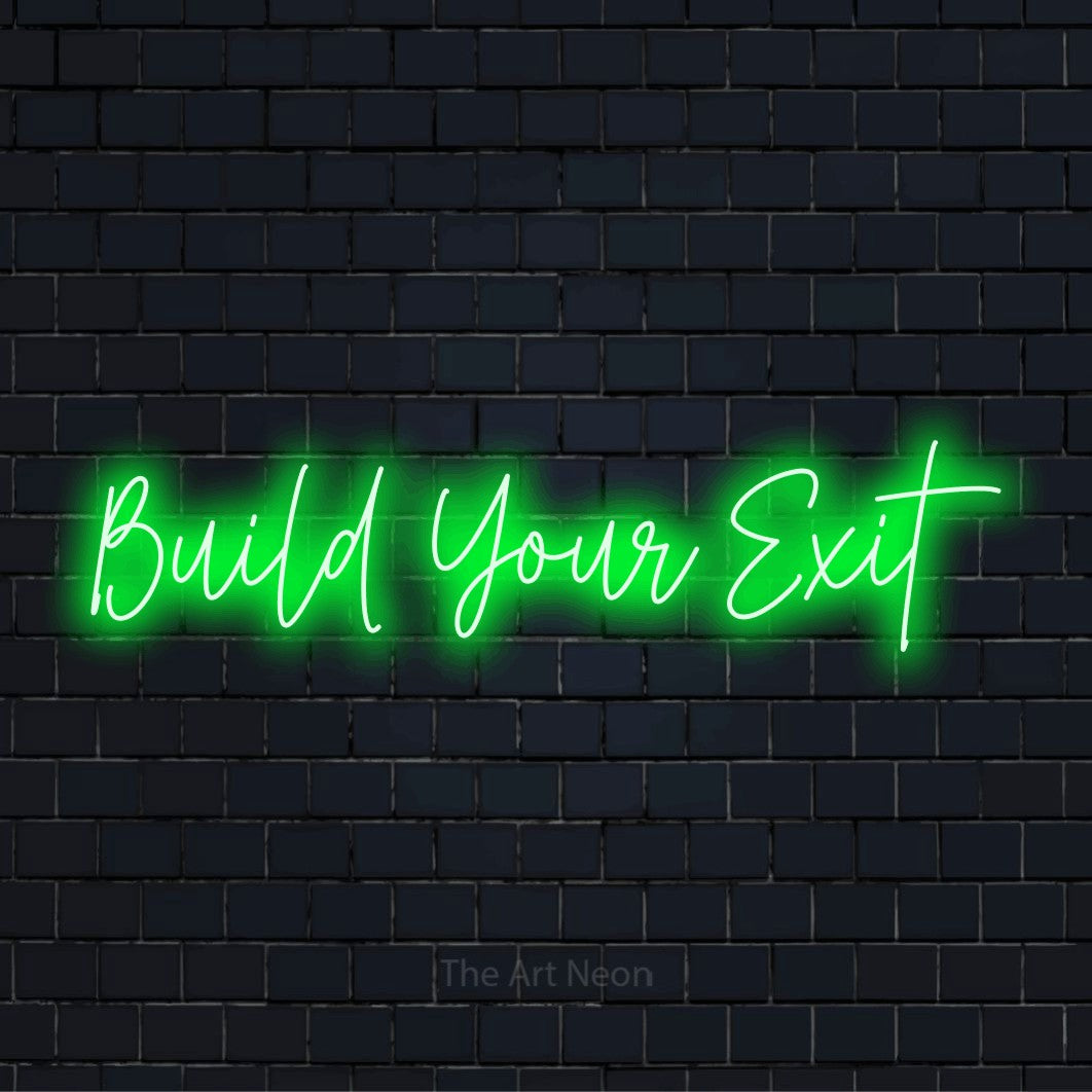 "Build Your Exit" neon text design on a black brick wall