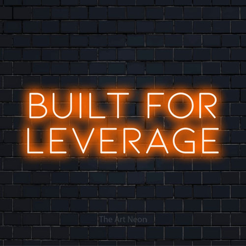 "Built For Leverage" text design with neon effect on a black brick wall