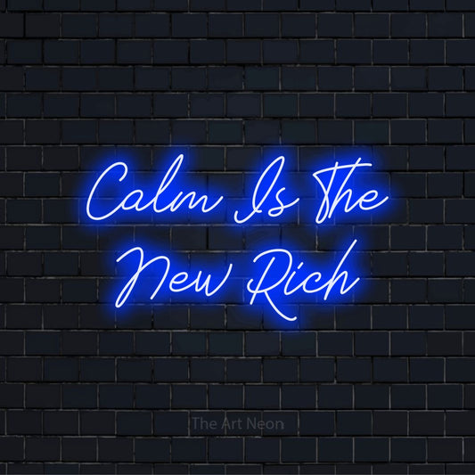 "Calm Is The New Rich" neon text design on a black brick wall