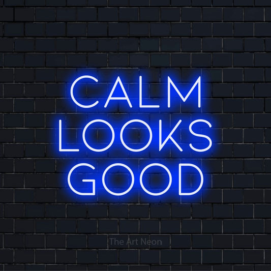 "Calm Looks Good" text design with neon effect on a black brick wall