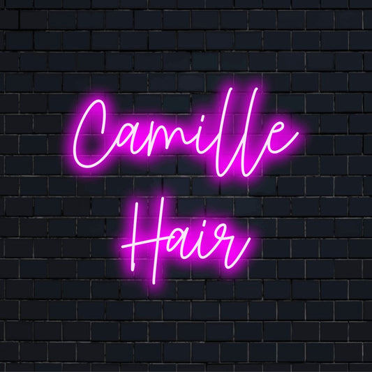 Camille Hair Custom Name Neon Sign, bright neon glow against black brick wall