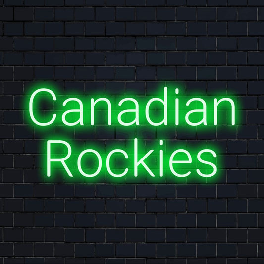 Canadian Rockies Neon Sign, glowing wall decor against black brick wall