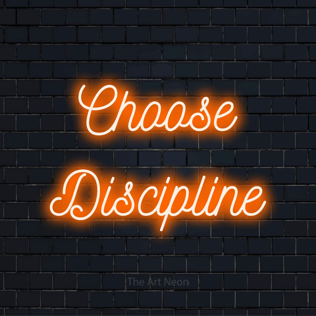 "Choose Discipline" LED neon sign on a black brick wall