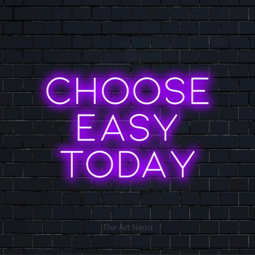 "Choose Easy Today" script-style LED neon sign on a black brick wall