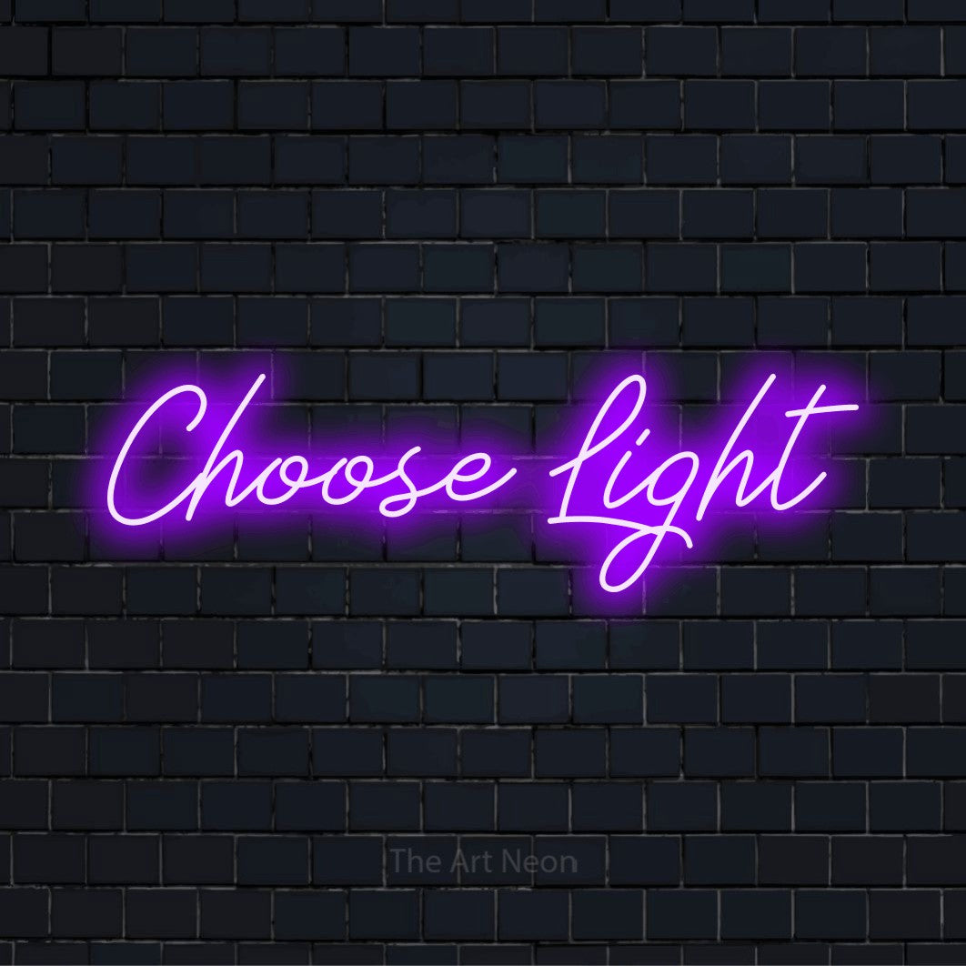 "Choose Light" script-style LED neon sign on a black brick wall
