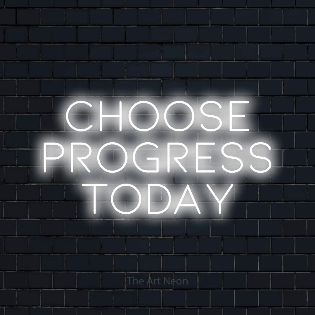 "Choose Progress Today" neon text design on a black brick wall