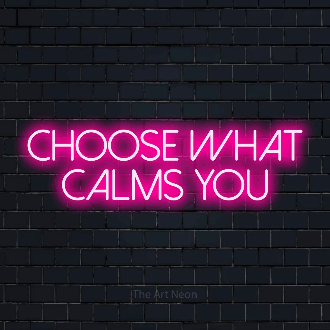 "Choose What Calms You" glowing LED neon sign on a black brick wall