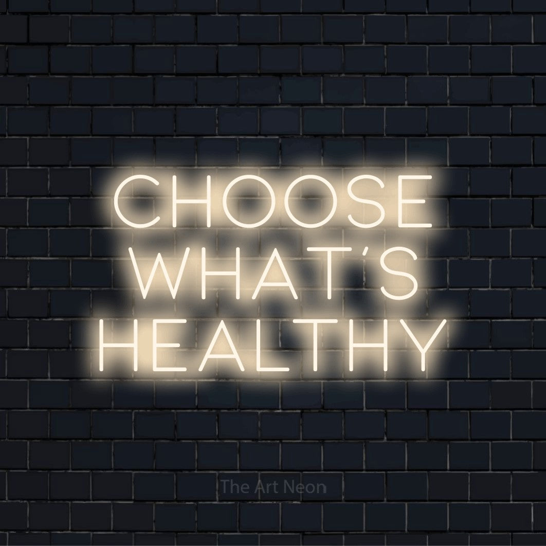 "Choose What’s Healthy" neon text design on a black brick wall