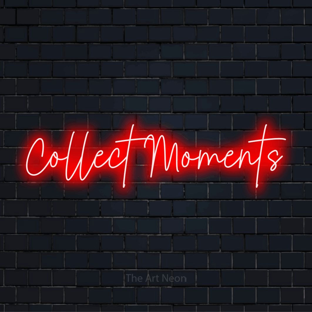"Collect Moments" LED neon sign on a black brick wall