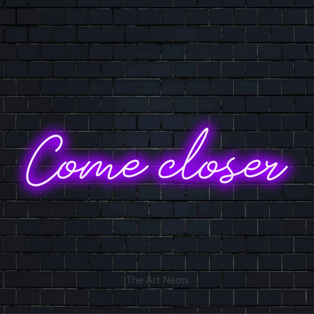 "Come Closer" glowing LED neon sign on a black brick wall