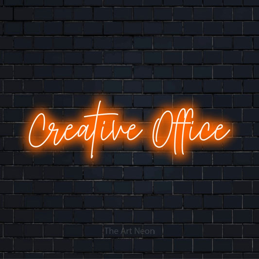 "Creative Office" neon text design on a black brick wall
