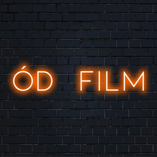 D Film Neon Sign, glowing wall decor against brick backdrop