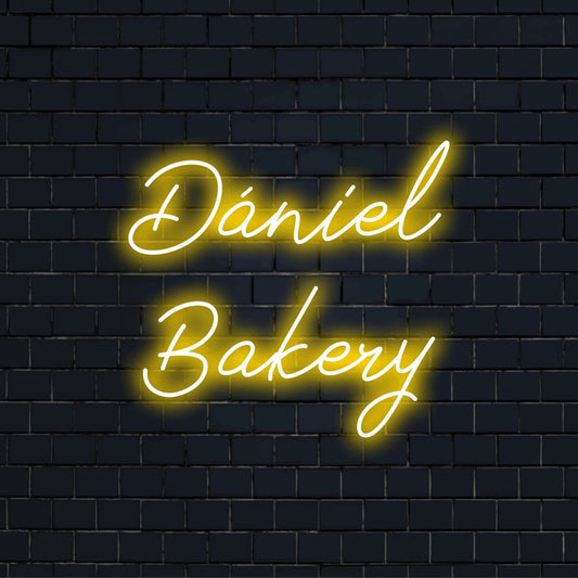 Daniel Bakery Custom Name Neon Sign, glowing wall decor on dark brick background