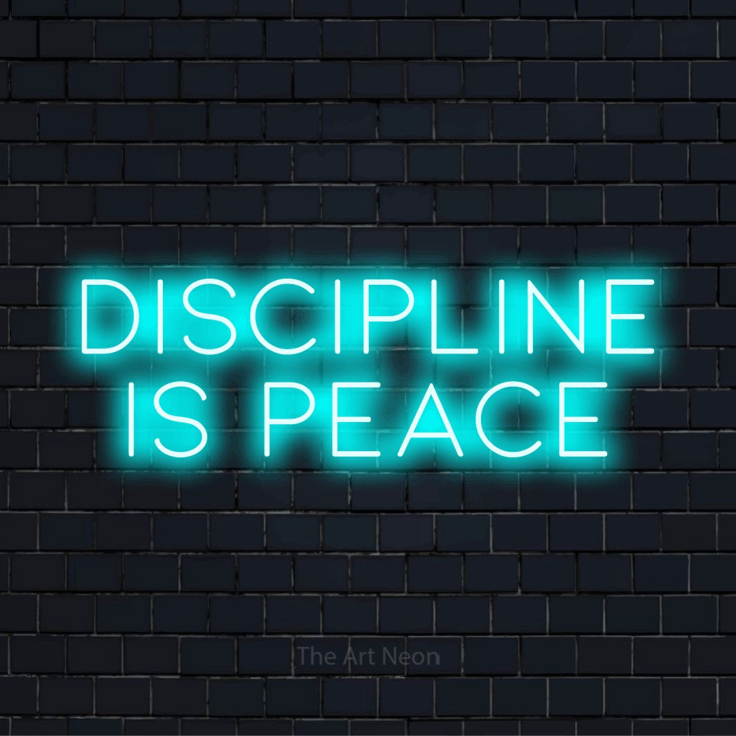 "Discipline Is Peace" text design with neon effect on a black brick wall