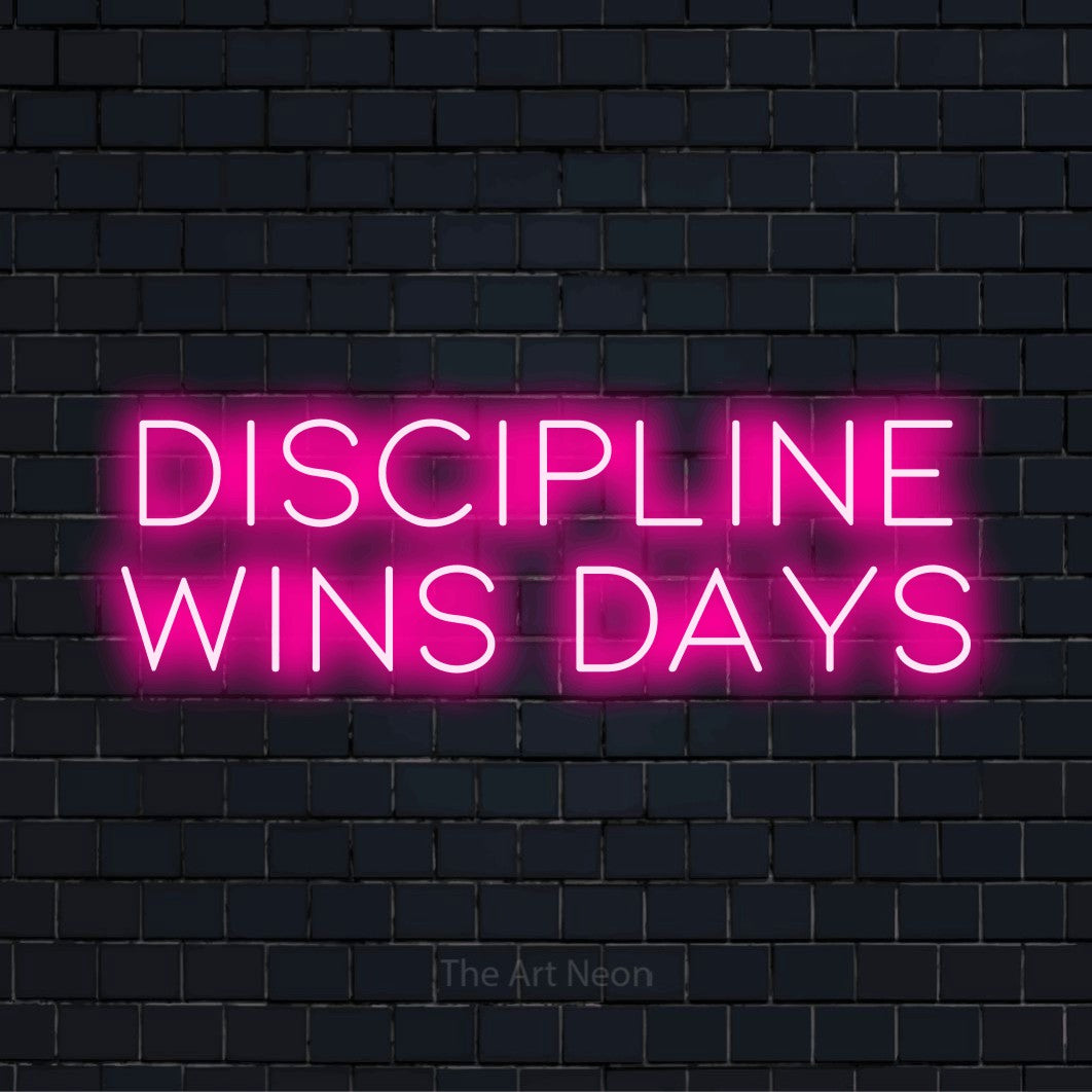 "Discipline Wins Days" neon text design on a black brick wall