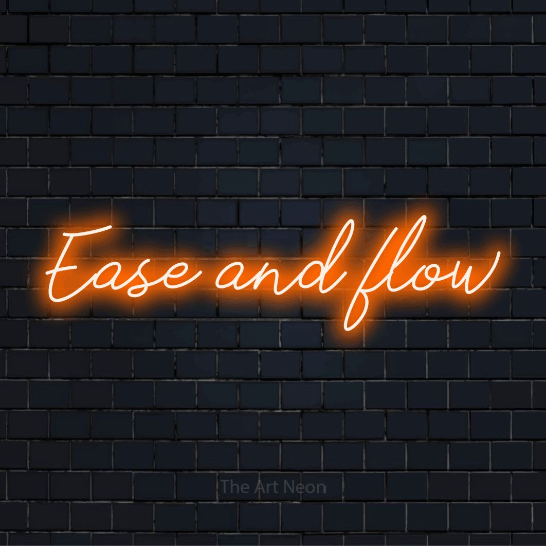 "Ease And Flow" script-style LED neon sign on a black brick wall