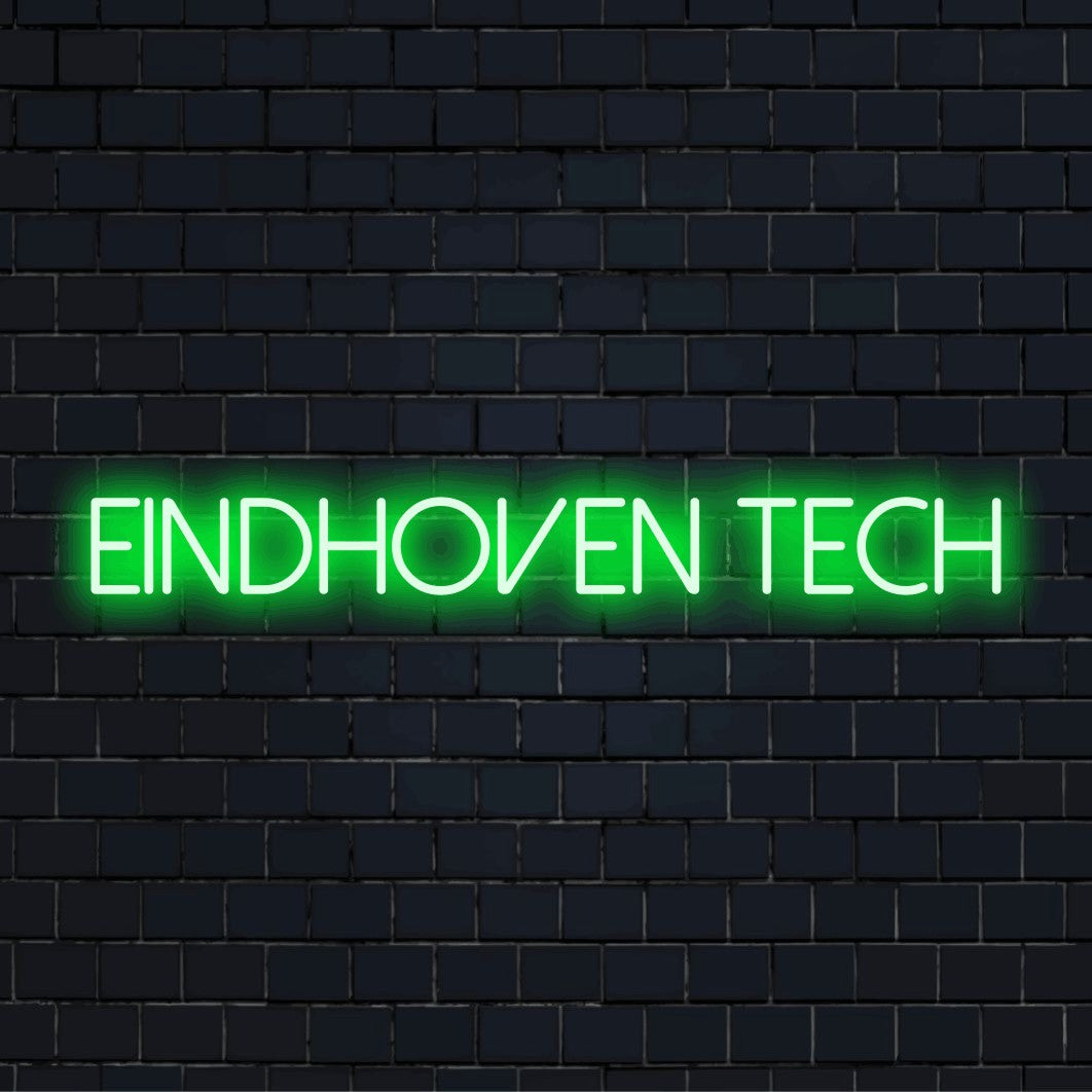 Eindhoven Tech LED Neon Sign, glowing lettering against black brick wall