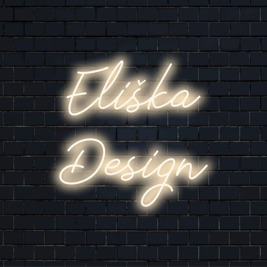 Eliska Design Custom Name Neon Sign, glowing lettering on dark brick wall