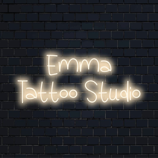 Emma Tattoo Studio Custom Name Neon Sign, bright neon glow against brick backdrop