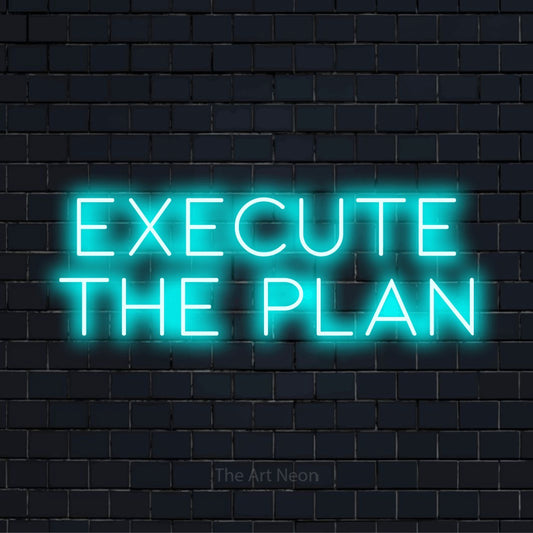 "Execute The Plan" script-style LED neon sign on a black brick wall