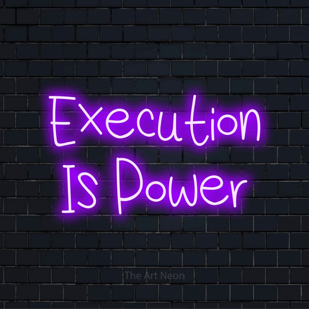 "Execution Is Power" script-style LED neon sign on a black brick wall