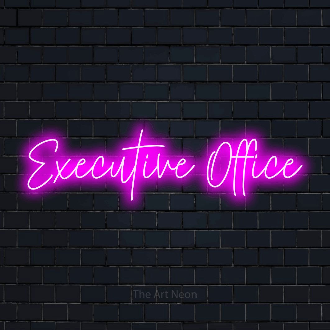 "Executive Office" glowing LED neon sign on a black brick wall