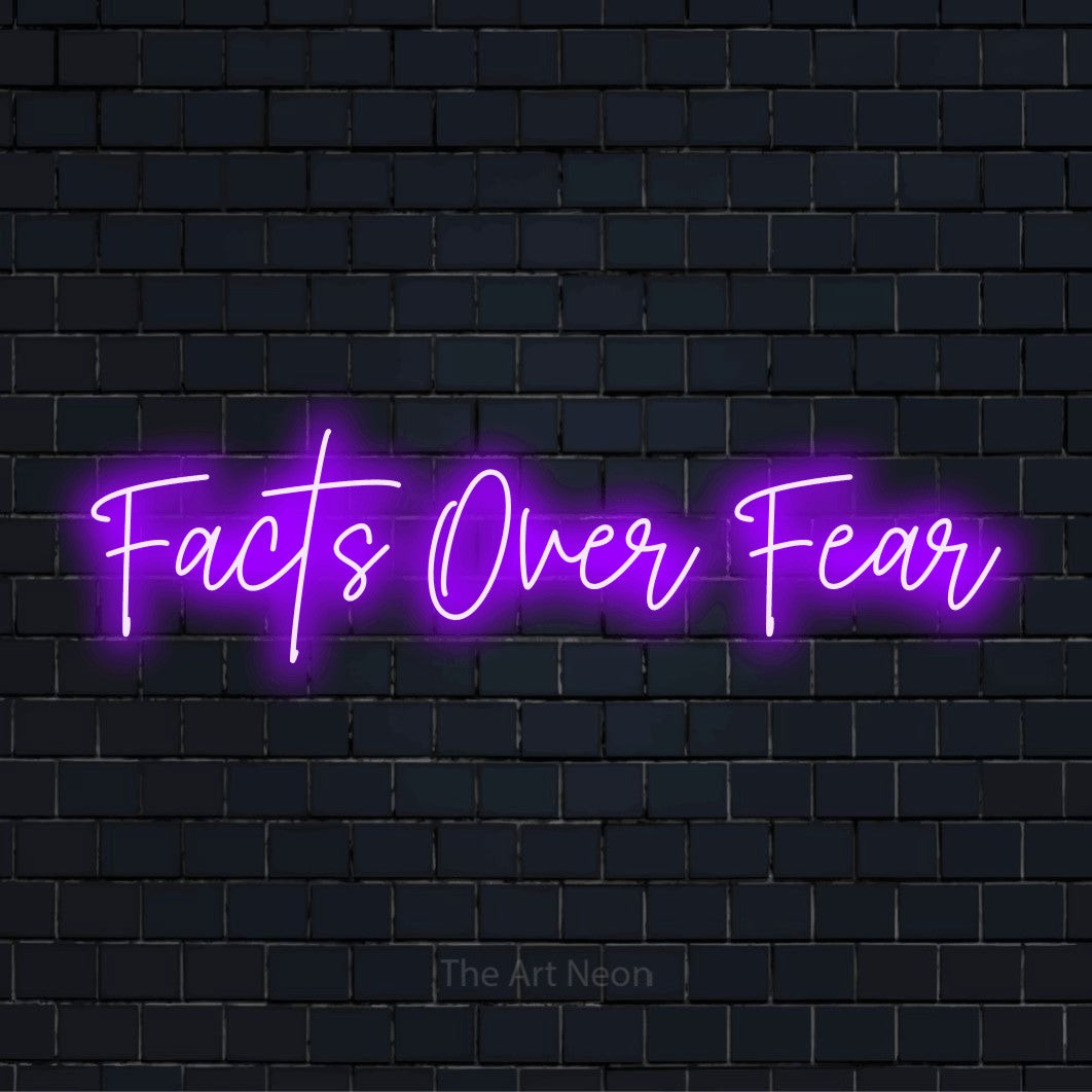 "Facts Over Fear" text design with neon effect on a black brick wall