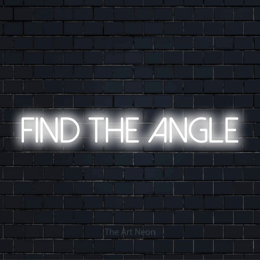 "Find The Angle" neon text design on a black brick wall