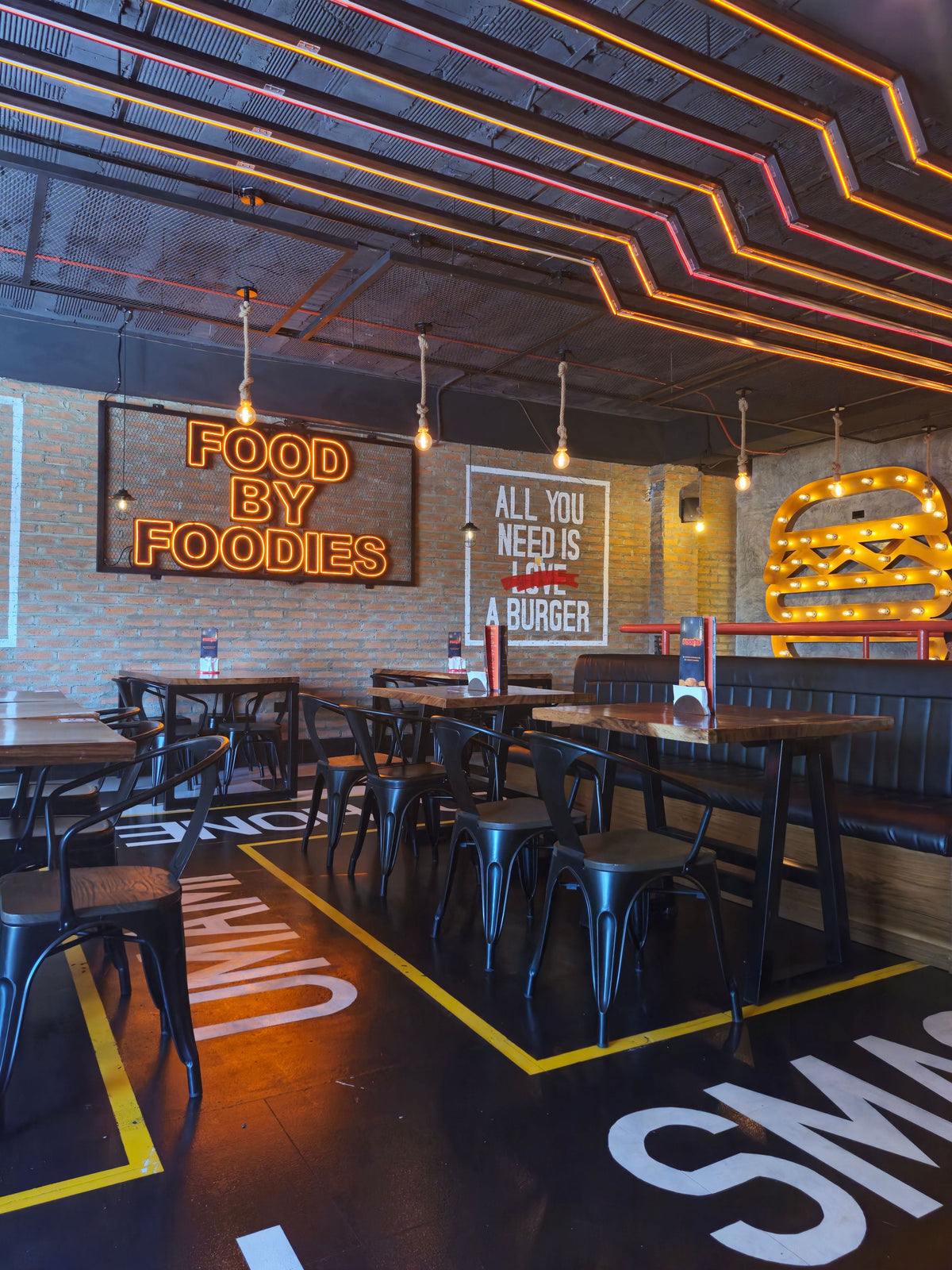 Custom LED neon sign creating a warm focal point inside a restaurant