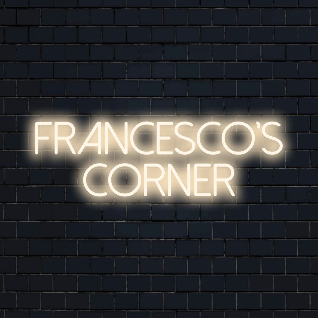 Francesco_s Corner Personalized LED Neon Sign, soft neon glow on dark brick wall