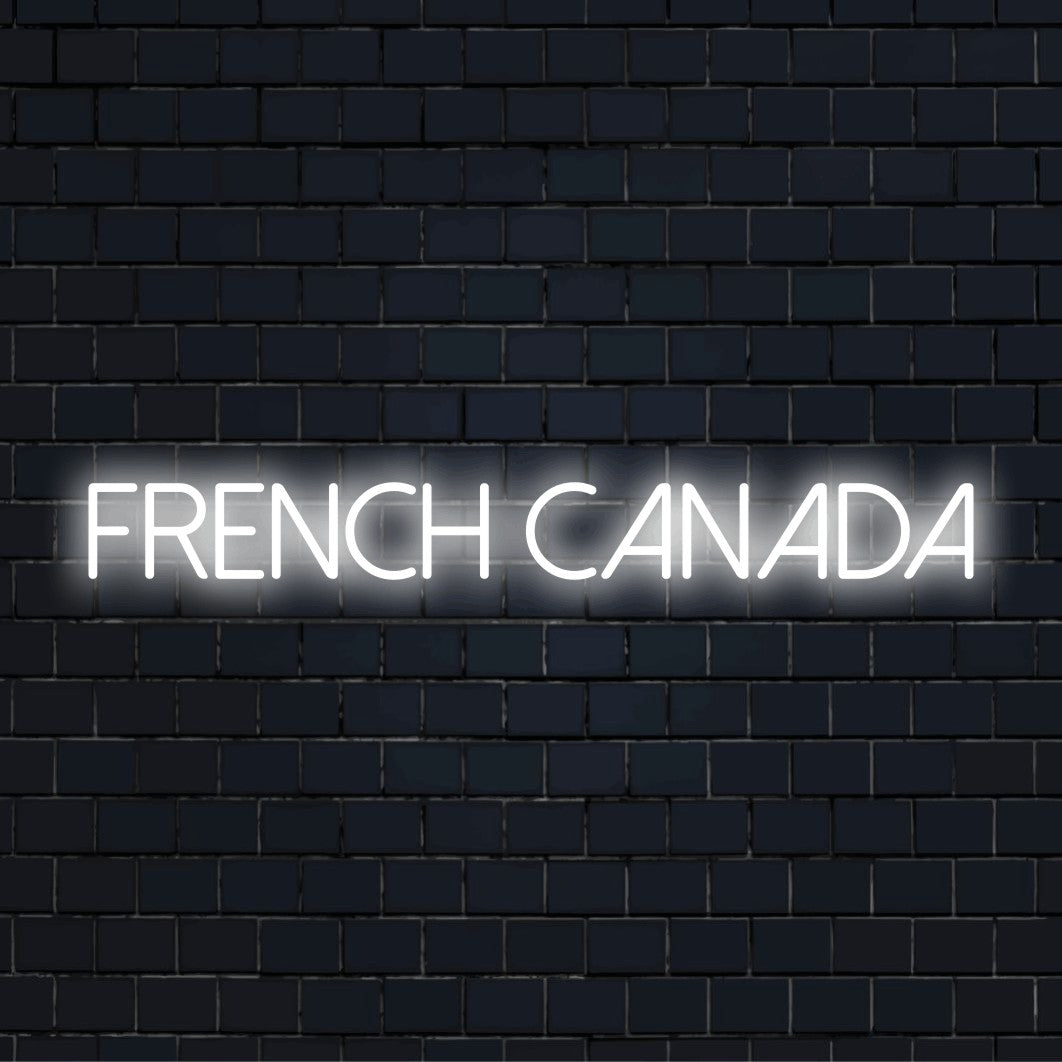 French Canada Neon Light with bright LED glow against brick backdrop