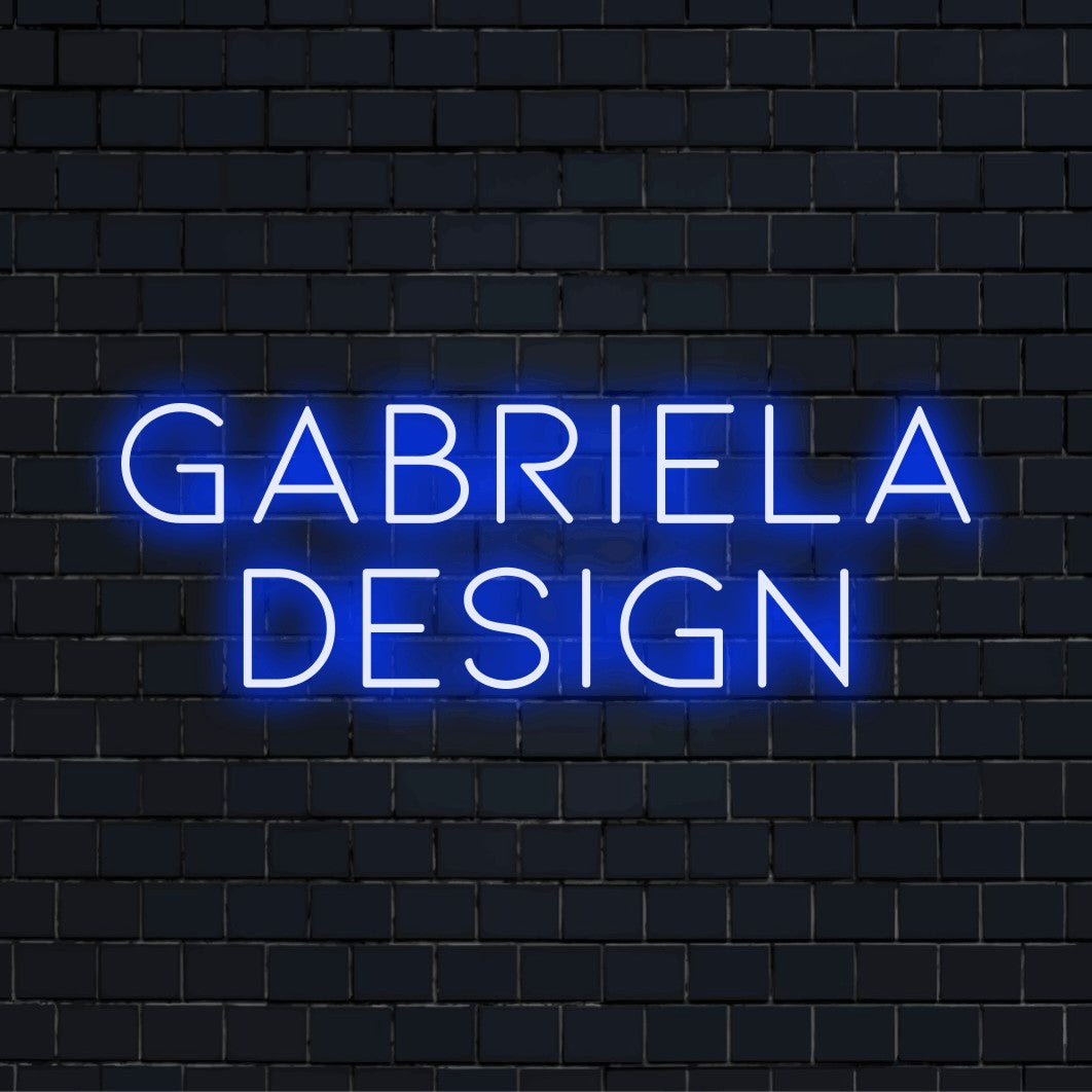 Gabriela Design Custom Name Neon Sign, glowing wall decor on black brick background