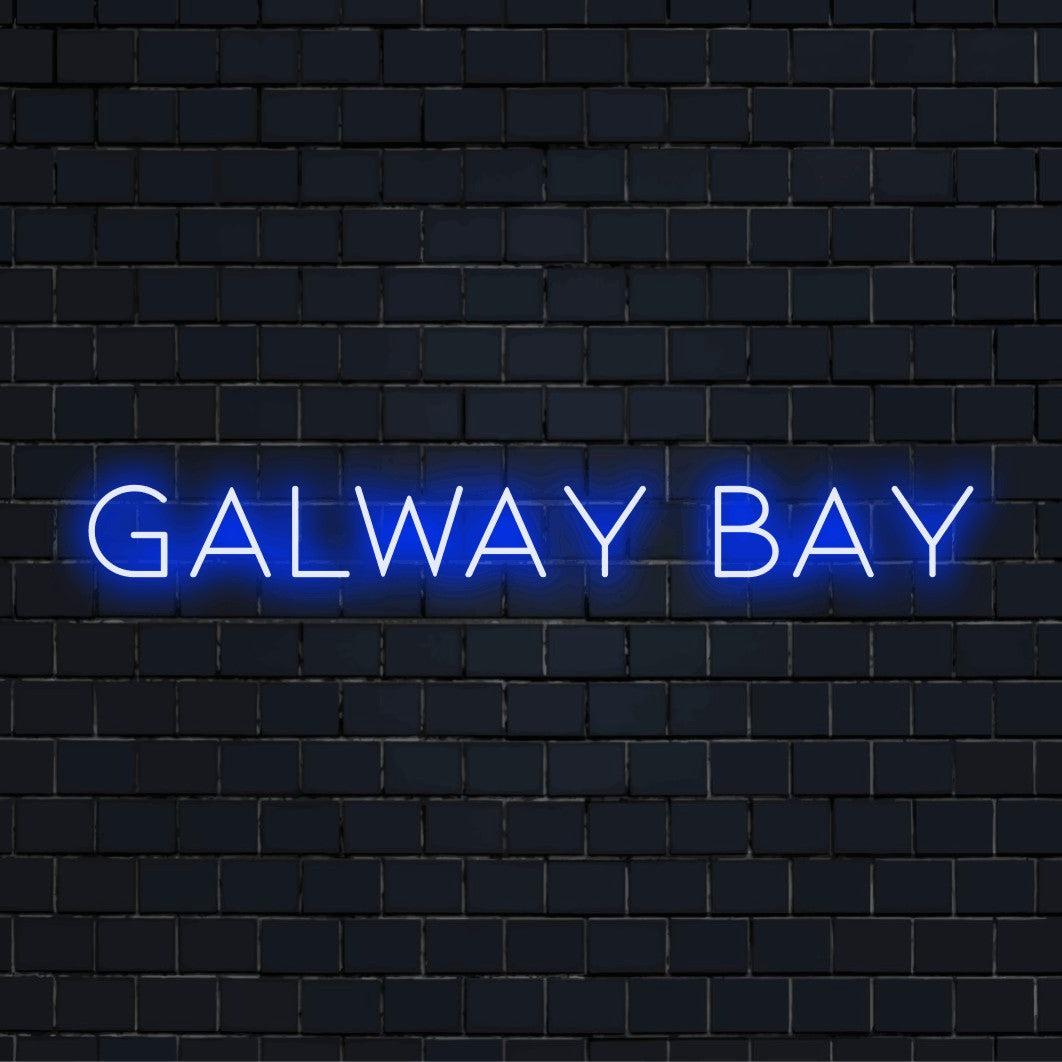 Galway Bay Neon Sign, glowing lettering on black brick background