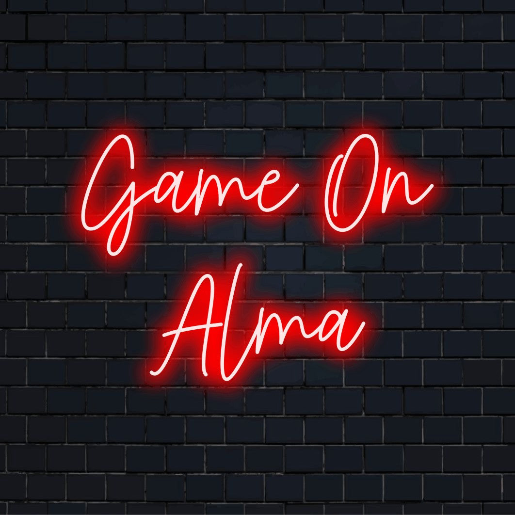 Game On Alma Personalized Neon Light with glowing neon text against brick backdrop