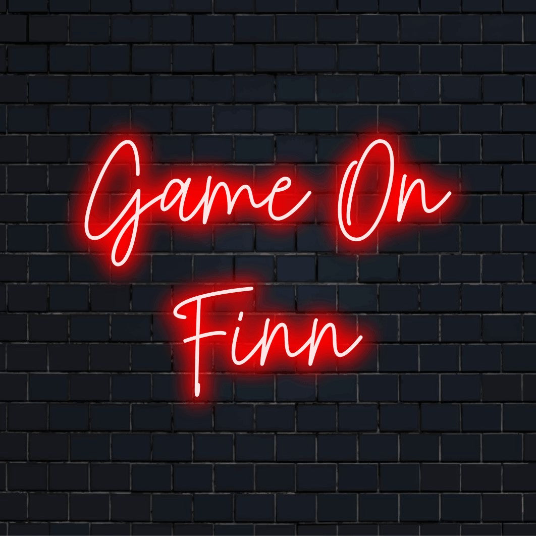 Game On Finn Custom Name Neon Sign, neon text light against black brick wall